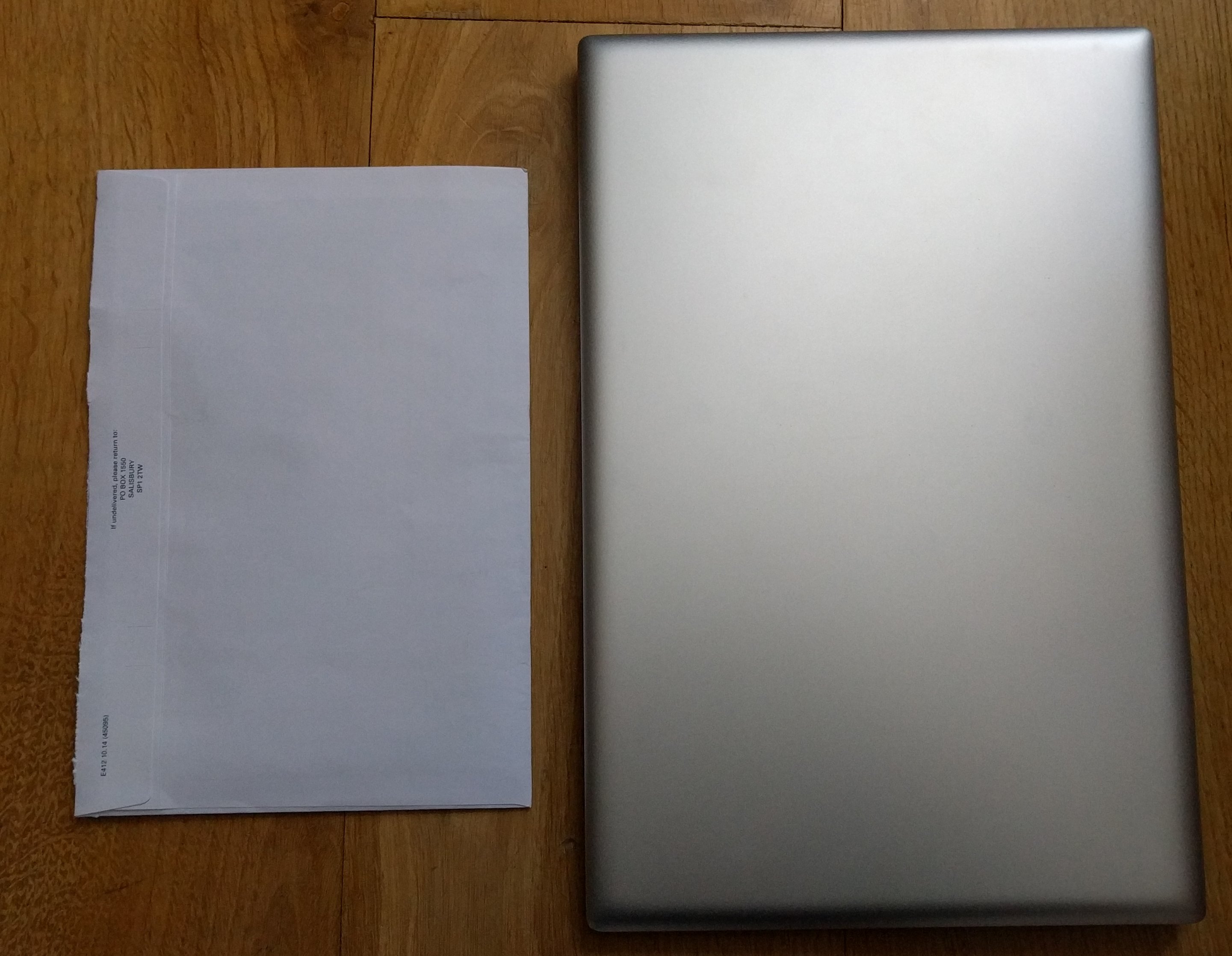 Top of machine against bank statement envelope - no glowing fruit...